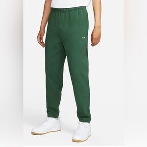 Green Nike swoosh sweatpants